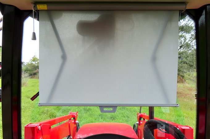 APOLLO-604-AC-CAB-TRACTOR-11 A pull down blind stops the steering wheel getting too hot.